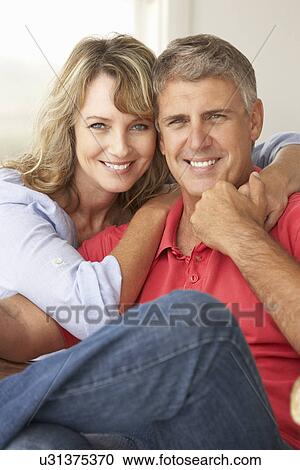 Stock Image - Mid age couple at home. Fotosearch