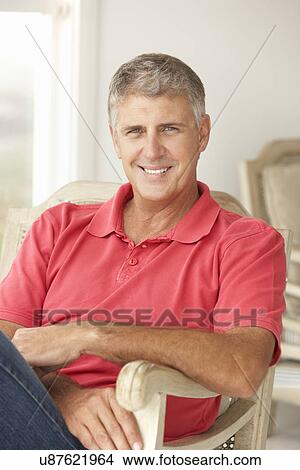 Mid age man at home View Large Photo Image Picture - Mid age man at home. Fotosearch