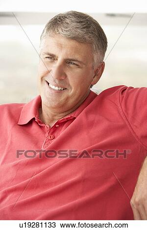 Stock Image - Mid age man at home. Fotosearch