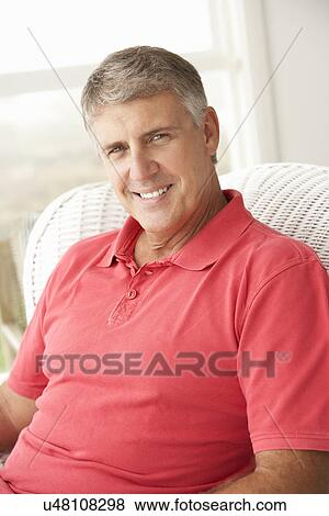 Mid age man at home View Large Photo Image Stock Photo - Mid age man at home. Fotosearch