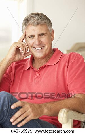 Mid age man at home View Large Photo Image Stock Photography - Mid age man at home. Fotosearch