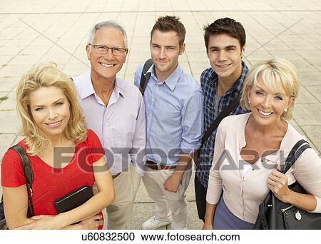 Stock Image - Mixed group of students outside college. Fotosearch