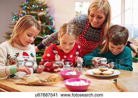Mother And Children Decorating Christmas Cookies Together View Large Photo Image Stock Image - Mother And Children Decorating Christmas Cookies Together. Fotosearch