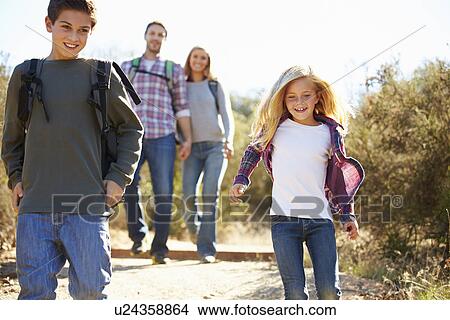 Mother And Children Hiking In Countryside Wearing Backpacks View Large Photo Image Picture - Mother And Children Hiking In Countryside Wearing Backpacks. Fotosearch
