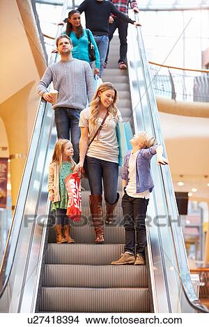 Mother And Children On Escalator In Shopping Mall View Large Photo Image Picture - Mother And Children On Escalator In Shopping Mall. Fotosearch