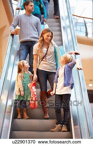 Mother And Children On Escalator In Shopping Mall View Large Photo Image Stock Image - Mother And Children On Escalator In Shopping Mall. Fotosearch