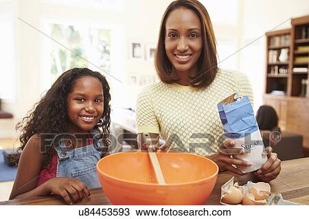 Mother And Daughter Baking Together At Home View Large Photo Image Stock Image - Mother And Daughter Baking Together At Home. Fotosearch