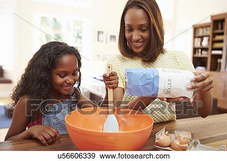 Mother And Daughter Baking Together At Home View Large Photo Image Stock Photo - Mother And Daughter Baking Together At Home. Fotosearch