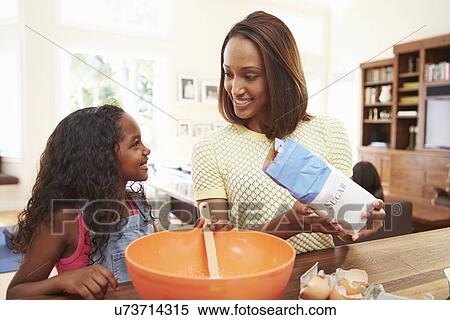 Mother And Daughter Baking Together At Home View Large Photo Image Stock Photography - Mother And Daughter Baking Together At Home. Fotosearch