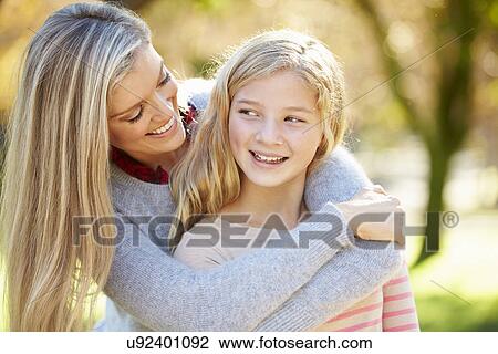 Stock Image - Mother And Daughter In Countryside. Fotosearch