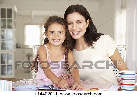 Mother and daughter scrapbooking View Large Photo Image Stock Image - Mother and daughter scrapbooking. Fotosearch