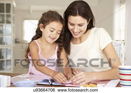 Mother and daughter scrapbooking View Large Photo Image Stock Photograph - Mother and daughter scrapbooking. Fotosearch
