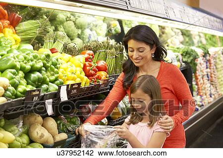 Mother and daughter shopping in supermarket View Large Photo Image Stock Image - Mother and daughter shopping in supermarket. Fotosearch