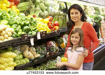 Mother and daughter shopping in supermarket View Large Photo Image Stock Image - Mother and daughter shopping in supermarket. Fotosearch