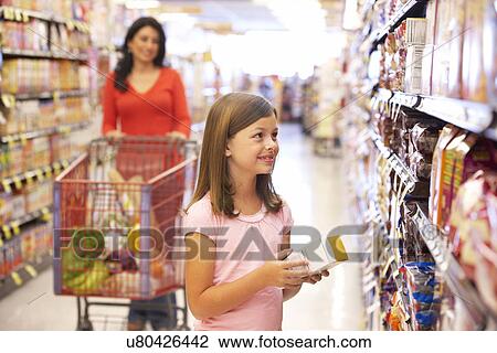 Mother and daughter shopping in supermarket View Large Photo Image Stock Image - Mother and daughter shopping in supermarket. Fotosearch