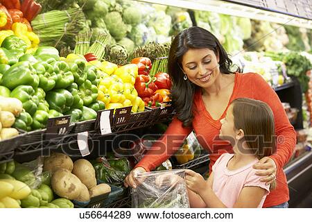 Mother and daughter shopping in supermarket View Large Photo Image Stock Photo - Mother and daughter shopping in supermarket. Fotosearch