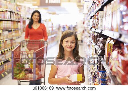 Mother and daughter shopping in supermarket View Large Photo Image Stock Photo - Mother and daughter shopping in supermarket. Fotosearch