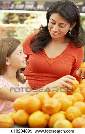 Mother and daughter shopping in supermarket View Large Photo Image Stock Photography - Mother and daughter shopping in supermarket. Fotosearch