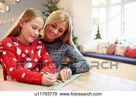 Stock Photo - Mother And Daughter Writing Letter To Santa Together. Fotosearch