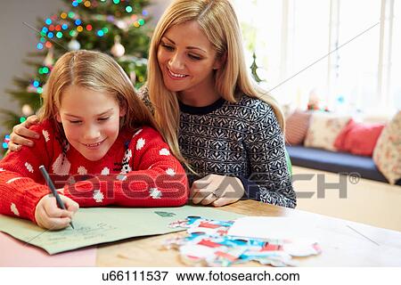 Mother And Daughter Writing Letter To Santa Together View Large Photo Image Stock Photo - Mother And Daughter Writing Letter To Santa Together. Fotosearch