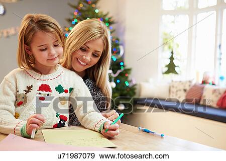 Stock Photo - Mother And Daughter Writing Letter To Santa Together. Fotosearch