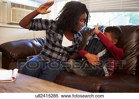 Mother Being Physically Abusive Towards Son At Home View Large Photo Image Stock Photography - Mother Being Physically Abusive Towards Son At Home. Fotosearch