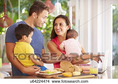 Mother Making Snack For Family In Kitchen View Large Photo Image Picture - Mother Making Snack For Family In Kitchen. Fotosearch