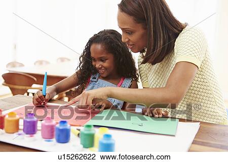 Mother Painting Picture With Daughter At Home View Large Photo Image Stock Image - Mother Painting Picture With Daughter At Home. Fotosearch
