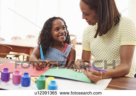 Mother Painting Picture With Daughter At Home View Large Photo Image Stock Photography - Mother Painting Picture With Daughter At Home. Fotosearch