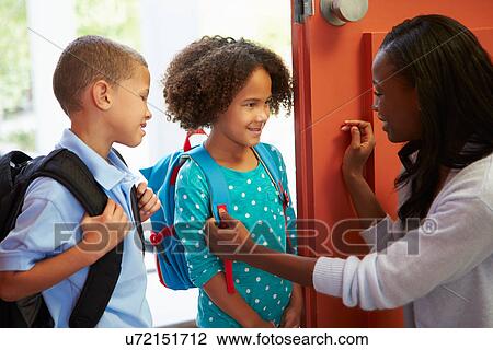 Mother Saying Goodbye To Children As They Leave For School View Large Photo Image Stock Image - Mother Saying Goodbye To Children As They Leave For School. Fotosearch