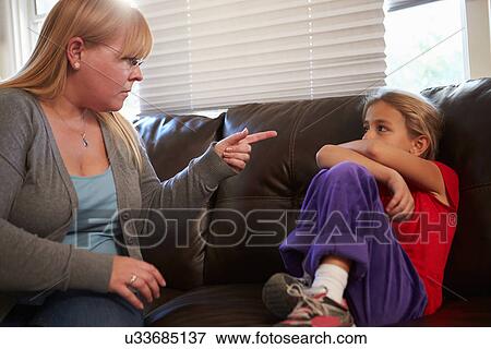 Mother Telling Off Daughter At Home View Large Photo Image Stock Photo - Mother Telling Off Daughter At Home. Fotosearch
