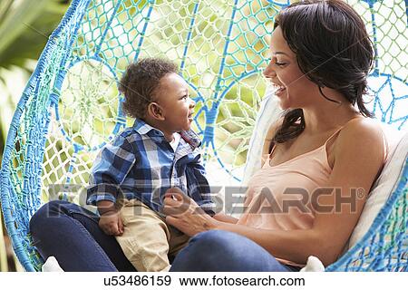 Mother With Baby Son Relaxing On Outdoor Garden Swing Seat View Large Photo Image Stock Photo - Mother With Baby Son Relaxing On Outdoor Garden Swing Seat. Fotosearch