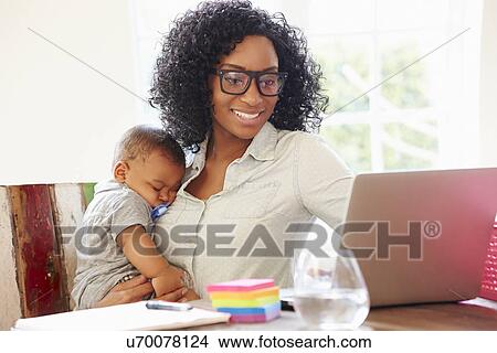 Mother With Baby Working In Office At Home View Large Photo Image Picture - Mother With Baby Working In Office At Home. Fotosearch
