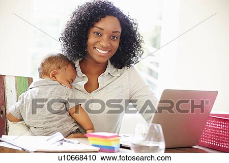 Mother With Baby Working In Office At Home View Large Photo Image Stock Image - Mother With Baby Working In Office At Home. Fotosearch