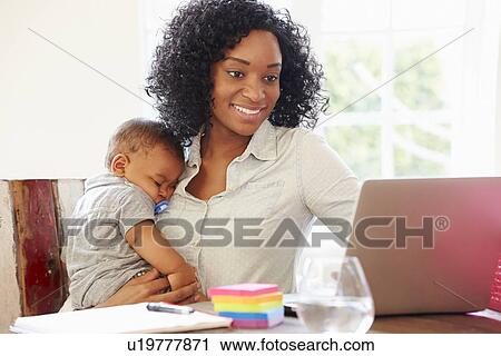 Mother With Baby Working In Office At Home View Large Photo Image Stock Image - Mother With Baby Working In Office At Home. Fotosearch