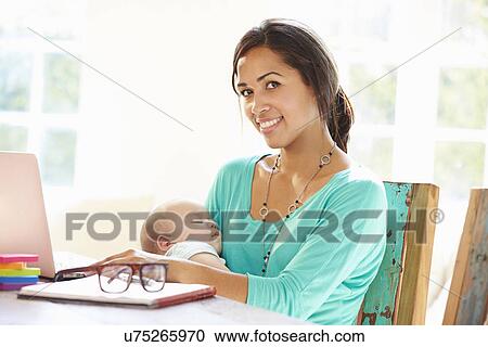 Mother With Baby Working In Office At Home View Large Photo Image Stock Image - Mother With Baby Working In Office At Home. Fotosearch