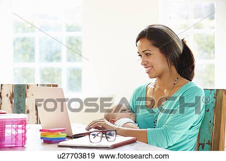 Mother With Baby Working In Office At Home View Large Photo Image Stock Photo - Mother With Baby Working In Office At Home. Fotosearch