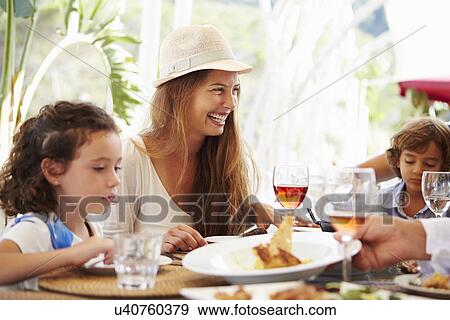 Mother With Children Enjoying Meal In Restaurant View Large Photo Image Stock Photo - Mother With Children Enjoying Meal In Restaurant. Fotosearch