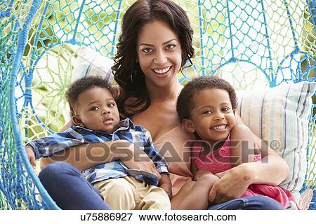 Mother With Children Relaxing On Outdoor Garden Swing Seat View Large Photo Image Stock Photo - Mother With Children Relaxing On Outdoor Garden Swing Seat. Fotosearch