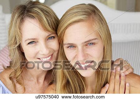 Stock Image - Mother with teenage daughter. Fotosearch