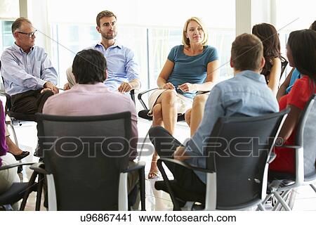 Stock Image - Multi-Cultural Office Staff Sitting Having Meeting Together. Fotosearch