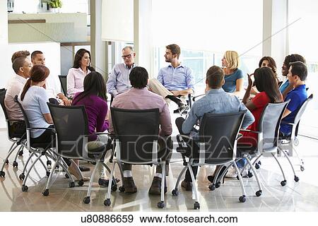Multi-Cultural Office Staff Sitting Having Meeting Together View Large Photo Image Stock Photo - Multi-Cultural Office Staff Sitting Having Meeting Together. Fotosearch
