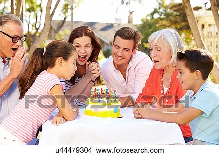 Multi-Generation Family Celebrating Birthday In Garden View Large Photo Image Picture - Multi-Generation Family Celebrating Birthday In Garden. Fotosearch