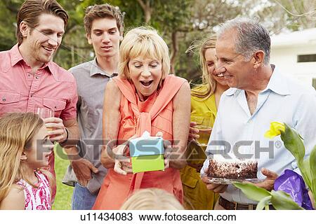 Multi Generation Family Celebrating Birthday In Garden View Large Photo Image Stock Image - Multi Generation Family Celebrating Birthday In Garden. Fotosearch