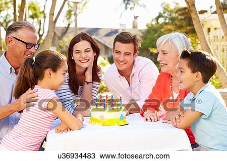 Multi-Generation Family Celebrating Birthday In Garden View Large Photo Image Stock Image - Multi-Generation Family Celebrating Birthday In Garden. Fotosearch
