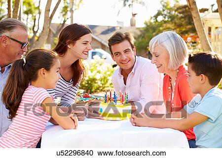 Multi-Generation Family Celebrating Birthday In Garden View Large Photo Image Stock Image - Multi-Generation Family Celebrating Birthday In Garden. Fotosearch