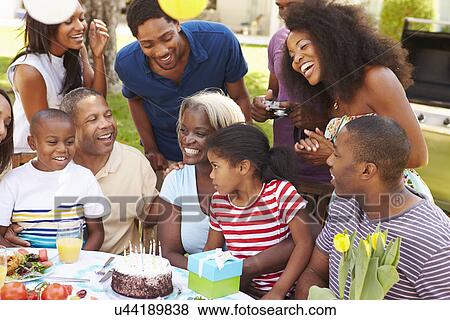 Multi Generation Family Celebrating Birthday In Garden View Large Photo Image Stock Photo - Multi Generation Family Celebrating Birthday In Garden. Fotosearch
