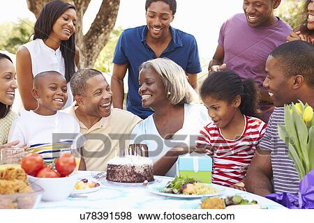 Multi Generation Family Celebrating Birthday In Garden View Large Photo Image Stock Photo - Multi Generation Family Celebrating Birthday In Garden. Fotosearch
