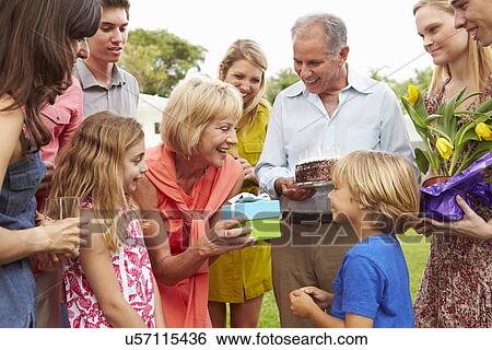 Multi Generation Family Celebrating Birthday In Garden View Large Photo Image Stock Photograph - Multi Generation Family Celebrating Birthday In Garden. Fotosearch