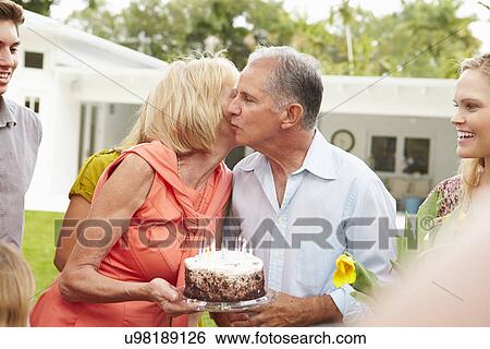 Multi Generation Family Celebrating Birthday In Garden View Large Photo Image Stock Photograph - Multi Generation Family Celebrating Birthday In Garden. Fotosearch
